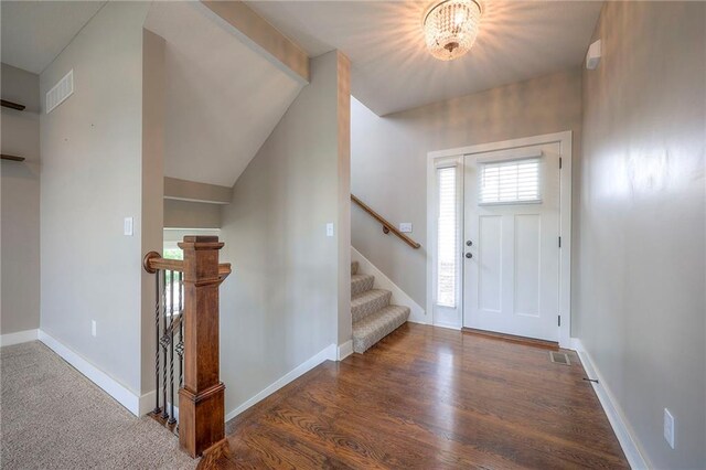 17304 S Schweiger Dr, Olathe, KS 66062 - foyer entrance featuring a chandelier, wood finished floors, and stairway