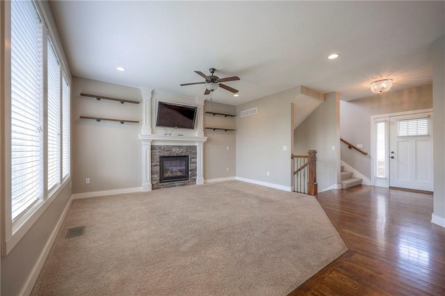 17304 S Schweiger Dr, Olathe, KS 66062 - unfurnished living room with recessed lighting, stairs, ceiling fan, and a fireplace