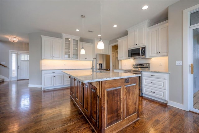 17304 S Schweiger Dr, Olathe, KS 66062 - kitchen featuring stainless steel appliances, tasteful backsplash, glass insert cabinets, dark wood-style flooring, and recessed lighting