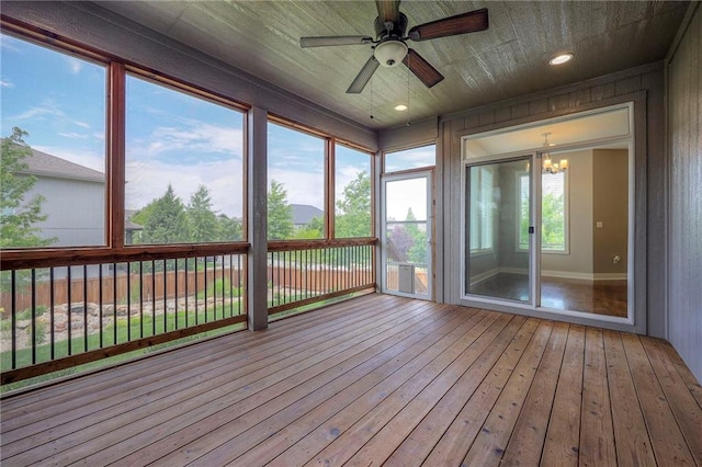 17304 S Schweiger Dr, Olathe, KS 66062 - unfurnished sunroom featuring a ceiling fan, hardwood / wood-style flooring, and a deck