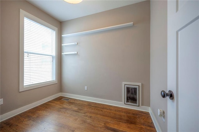 17304 S Schweiger Dr, Olathe, KS 66062 - laundry room with plenty of natural light and dark wood finished floors