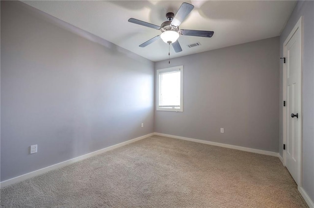 17304 S Schweiger Dr, Olathe, KS 66062 - spare room featuring light colored carpet and a ceiling fan