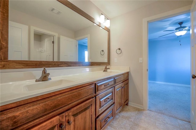 17304 S Schweiger Dr, Olathe, KS 66062 - full bath with double vanity, ceiling fan, and tile patterned flooring