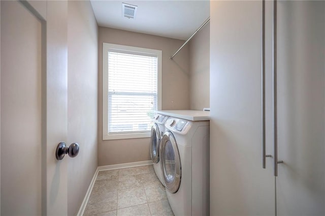 17304 S Schweiger Dr, Olathe, KS 66062 - washroom featuring washing machine and dryer and light tile patterned floors