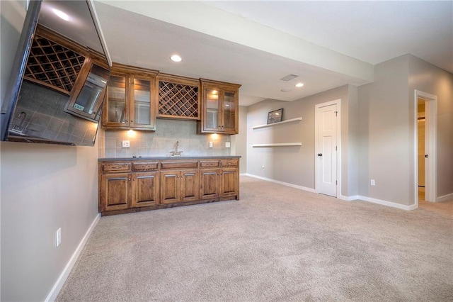17304 S Schweiger Dr, Olathe, KS 66062 - indoor wet bar with light colored carpet, backsplash, and recessed lighting