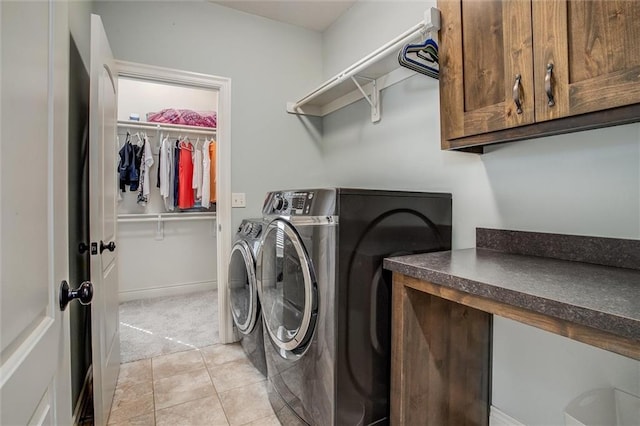 17224 Haskins St, Overland Park, KS 66062 - laundry area featuring washing machine and clothes dryer, cabinet space, light tile patterned flooring, and light carpet