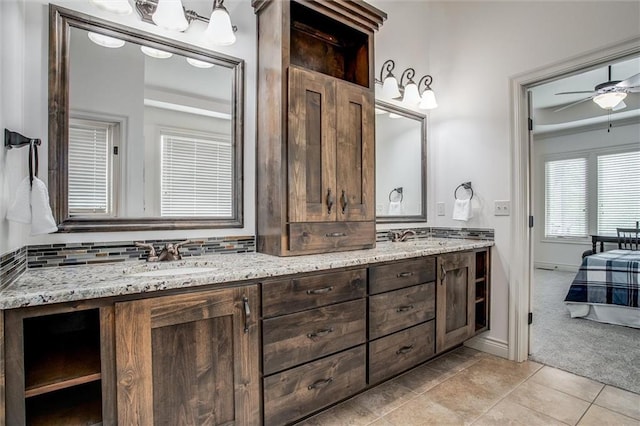 17224 Haskins St, Overland Park, KS 66062 - ensuite bathroom featuring double vanity, a ceiling fan, and tile patterned flooring