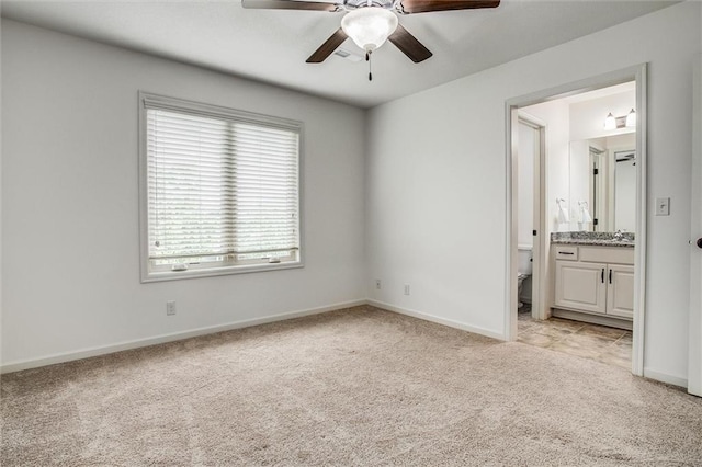 17224 Haskins St, Overland Park, KS 66062 - unfurnished bedroom with light carpet, connected bathroom, and ceiling fan