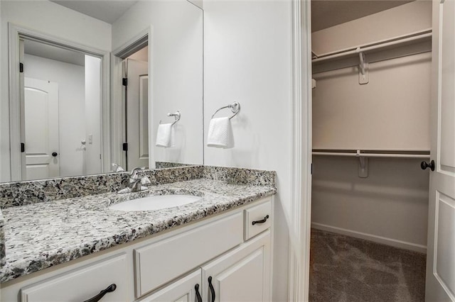 17224 Haskins St, Overland Park, KS 66062 - bathroom featuring vanity and a spacious closet
