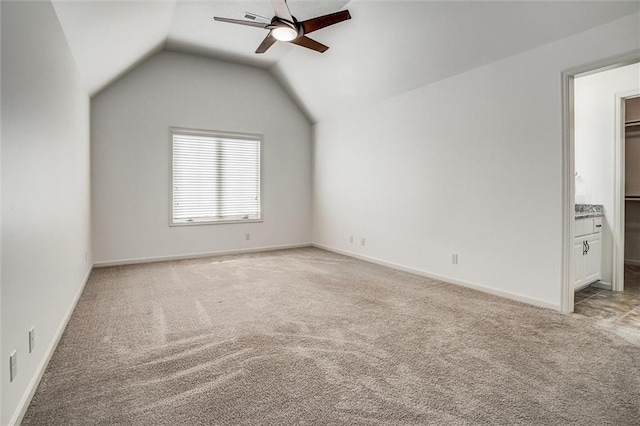 17224 Haskins St, Overland Park, KS 66062 - unfurnished bedroom featuring light carpet, vaulted ceiling, and a ceiling fan