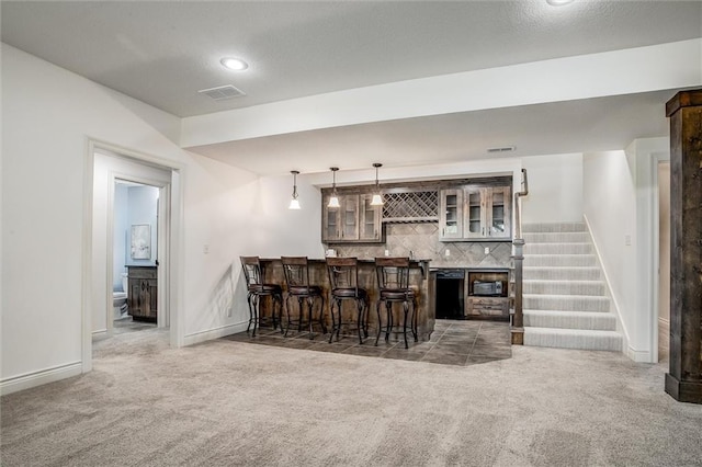 17224 Haskins St, Overland Park, KS 66062 - indoor wet bar featuring carpet flooring, decorative backsplash, stairway, and hanging light fixtures