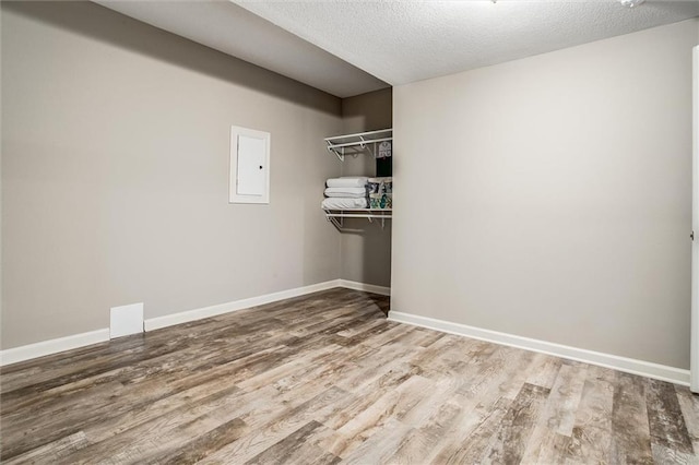 17224 Haskins St, Overland Park, KS 66062 - spacious closet featuring wood finished floors and electric panel