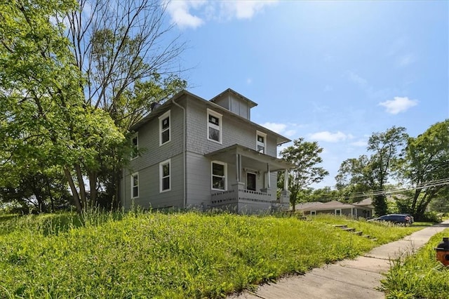 2921 E 54th St, Kansas City, MO 64130 - view of side of home featuring a porch