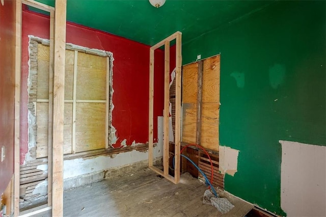2921 E 54th St, Kansas City, MO 64130 - spare room with wood finished floors