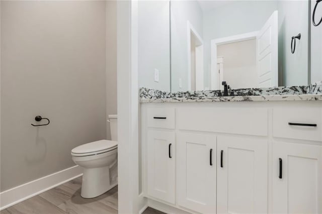 3116 SW Summit View Trl, Lees Summit, MO 64082 - bathroom featuring toilet, baseboards, and vanity
