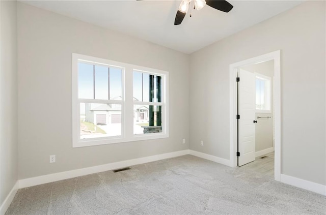 3116 SW Summit View Trl, Lees Summit, MO 64082 - carpeted spare room with plenty of natural light, ceiling fan, and baseboards