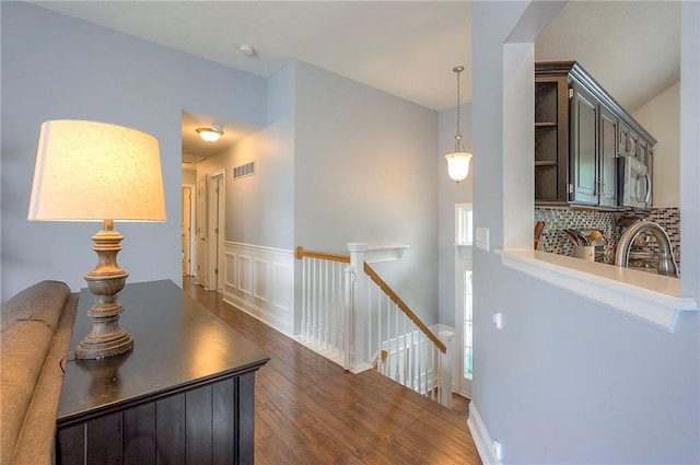 23600 W 59th St, Shawnee, KS 66226 - corridor with an upstairs landing, hardwood / wood-style flooring, and a sink