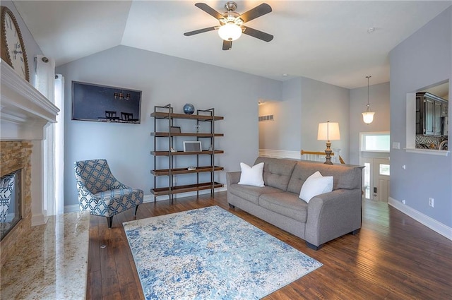 23600 W 59th St, Shawnee, KS 66226 - living room featuring hardwood / wood-style floors, a ceiling fan, a fireplace, baseboards, and vaulted ceiling