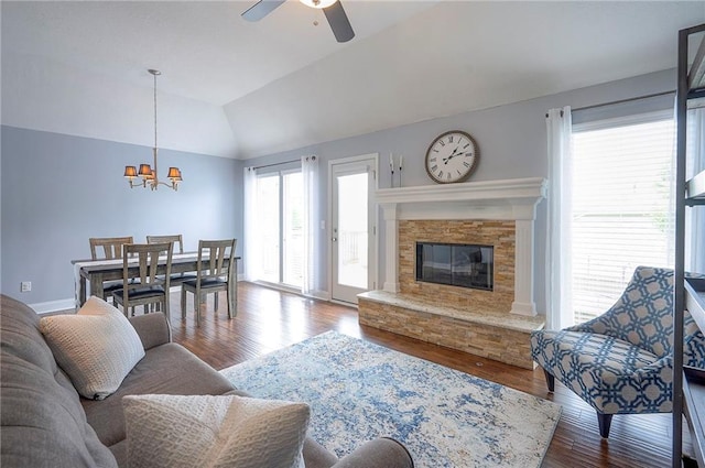 23600 W 59th St, Shawnee, KS 66226 - living area featuring plenty of natural light, a ceiling fan, a chandelier, wood finished floors, and lofted ceiling