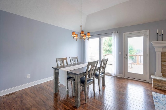 23600 W 59th St, Shawnee, KS 66226 - dining room with a chandelier, lofted ceiling, dark wood finished floors, and baseboards