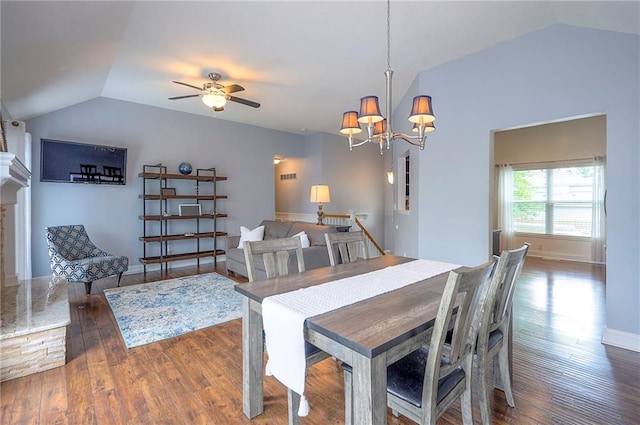 23600 W 59th St, Shawnee, KS 66226 - dining room with lofted ceiling, a chandelier, wood finished floors, ceiling fan, and baseboards