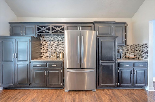 23600 W 59th St, Shawnee, KS 66226 - kitchen with freestanding refrigerator, backsplash, dark wood finished floors, and light countertops
