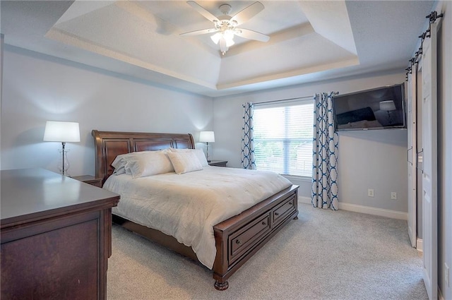 23600 W 59th St, Shawnee, KS 66226 - bedroom featuring a tray ceiling, light colored carpet, baseboards, and a ceiling fan