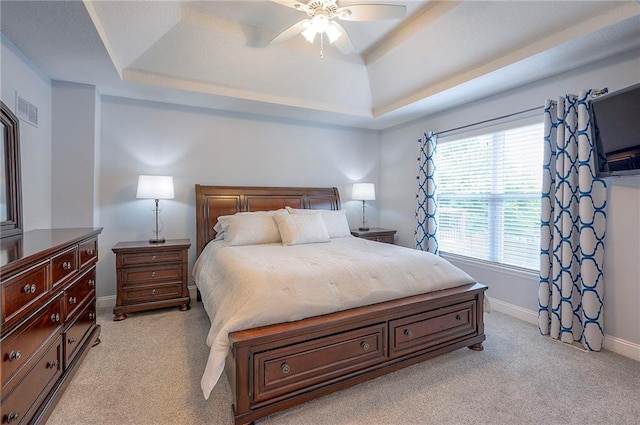 23600 W 59th St, Shawnee, KS 66226 - bedroom featuring a tray ceiling, light colored carpet, and baseboards