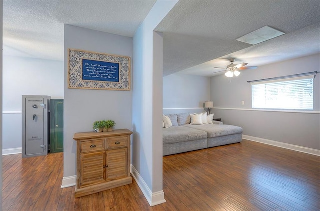 23600 W 59th St, Shawnee, KS 66226 - bedroom with a textured ceiling, hardwood / wood-style flooring, baseboards, and a ceiling fan