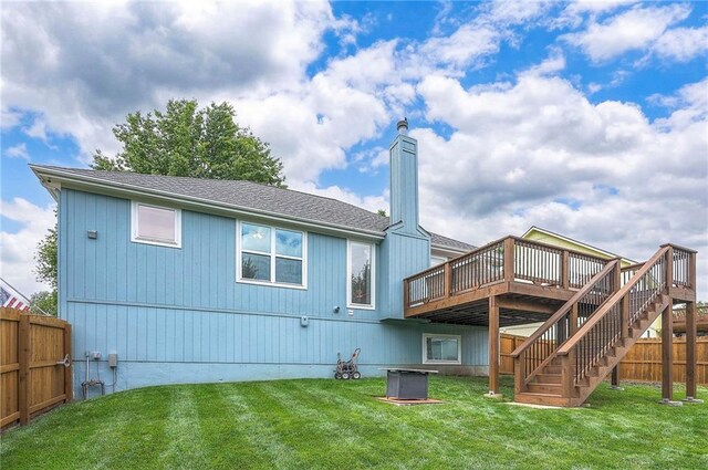 23600 W 59th St, Shawnee, KS 66226 - rear view of property featuring a deck, a chimney, stairway, and a shingled roof