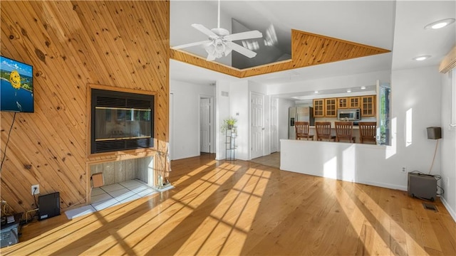 1145 Camp Branch Rd, Sunrise Beach, MO 65079 - unfurnished living room with wood finished floors, a ceiling fan, wooden walls, and recessed lighting
