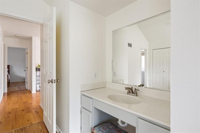 1145 Camp Branch Rd, Sunrise Beach, MO 65079 - bathroom with wood finished floors and vanity