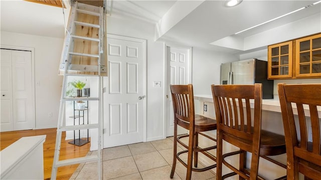 1145 Camp Branch Rd, Sunrise Beach, MO 65079 - dining area featuring light tile patterned floors and baseboards