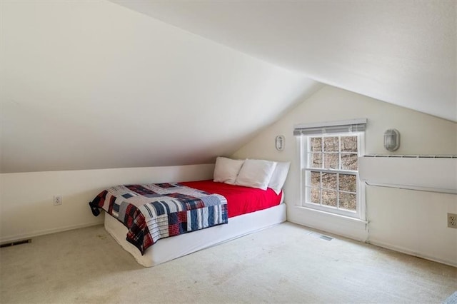 1145 Camp Branch Rd, Sunrise Beach, MO 65079 - carpeted bedroom with lofted ceiling and baseboards