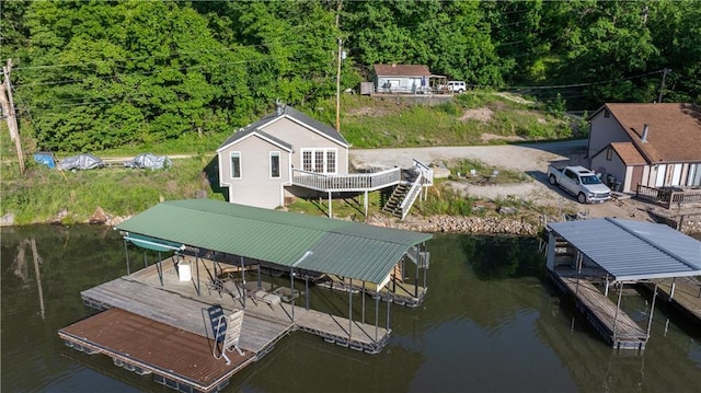 1145 Camp Branch Rd, Sunrise Beach, MO 65079 - dock featuring a water view, boat lift, and a wooded view