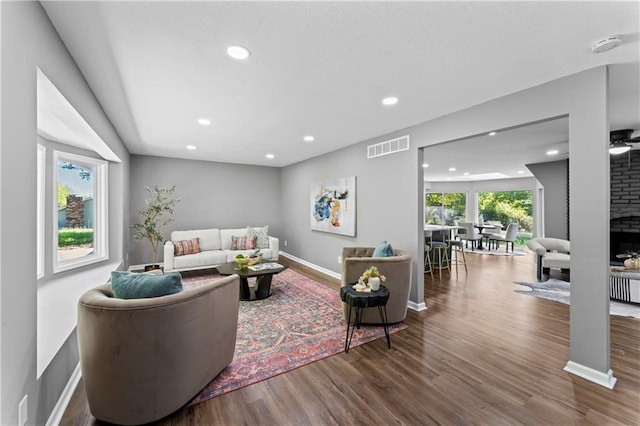 2081 Willow Ln, Excelsior Springs, MO 64024 - living room featuring wood finished floors, recessed lighting, a fireplace, and baseboards