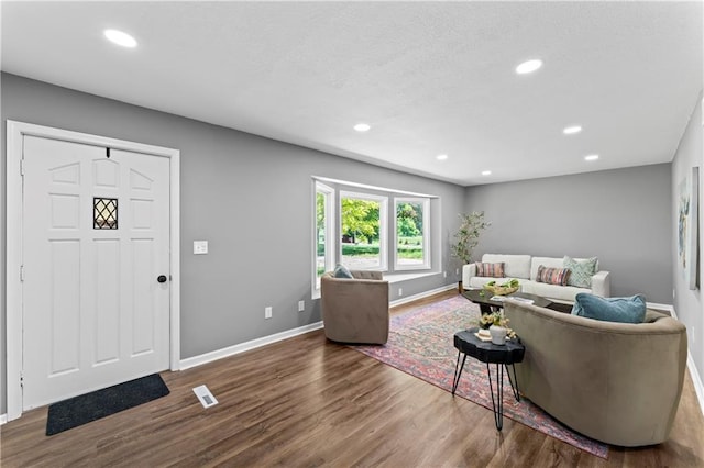 2081 Willow Ln, Excelsior Springs, MO 64024 - living room featuring baseboards, wood finished floors, and recessed lighting