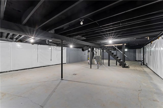 2081 Willow Ln, Excelsior Springs, MO 64024 - unfinished basement with stairway and heating unit