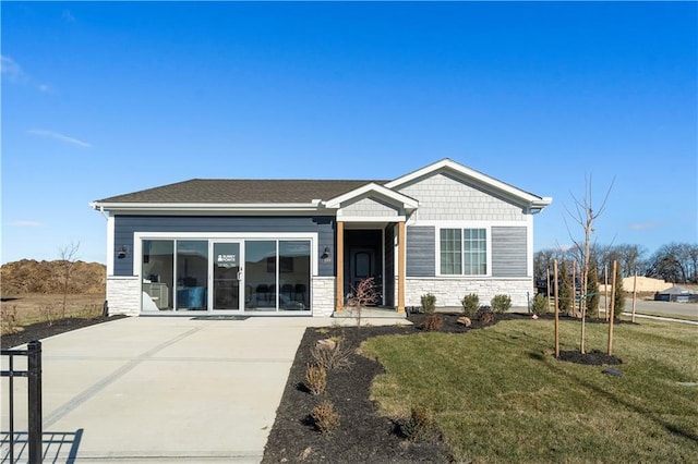 27101 E Oak View Dr, Lees Summit, MO 64086 - view of front of property with stone siding, a front yard, and concrete driveway