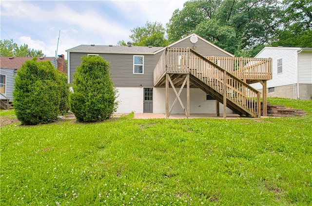 5539 NW Adrian Ave, Houston Lake, MO 64151 - rear view of house with a deck, stairway, and a lawn