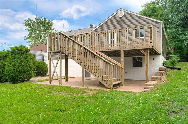 5539 NW Adrian Ave, Houston Lake, MO 64151 - back of property featuring a patio area, a wooden deck, and stairway