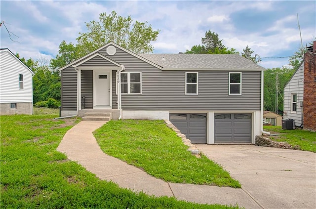 5539 NW Adrian Ave, Houston Lake, MO 64151 - view of front of home with an attached garage, a front yard, concrete driveway, and roof with shingles