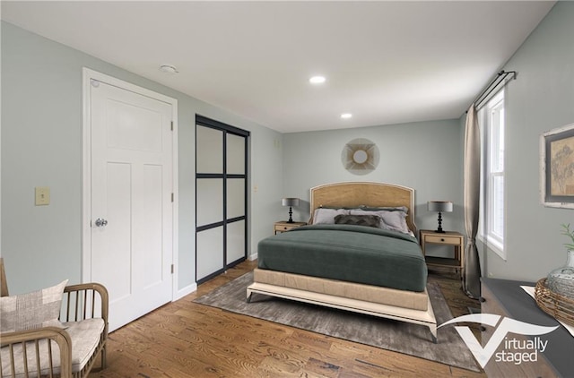 5539 NW Adrian Ave, Houston Lake, MO 64151 - bedroom featuring wood finished floors and recessed lighting