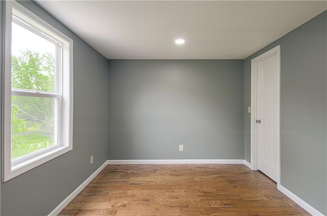 5539 NW Adrian Ave, Houston Lake, MO 64151 - spare room featuring light wood finished floors and recessed lighting