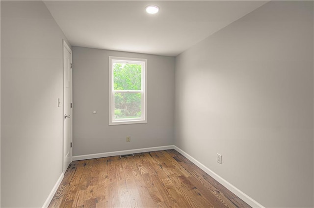 5539 NW Adrian Ave, Houston Lake, MO 64151 - spare room with baseboards and wood finished floors
