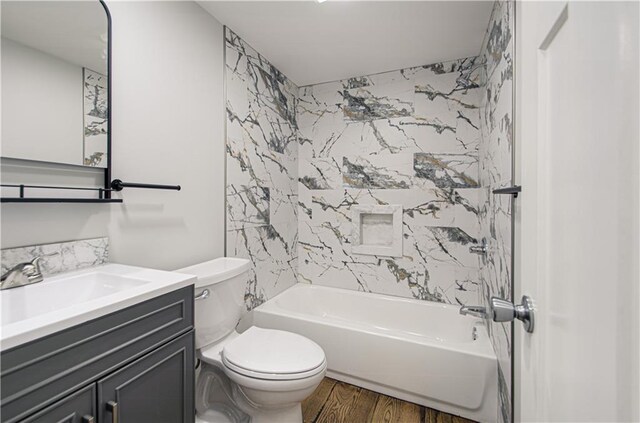5539 NW Adrian Ave, Houston Lake, MO 64151 - full bathroom with wood finished floors, vanity, and shower / washtub combination