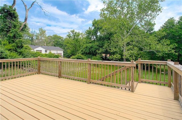 5539 NW Adrian Ave, Houston Lake, MO 64151 - wooden deck with view of scattered trees