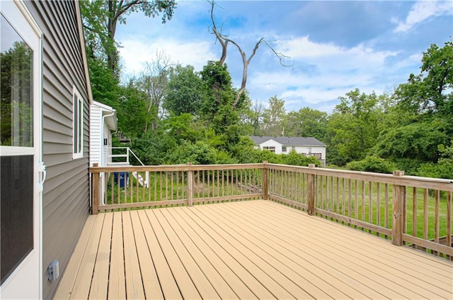 5539 NW Adrian Ave, Houston Lake, MO 64151 - wooden terrace with view of wooded area