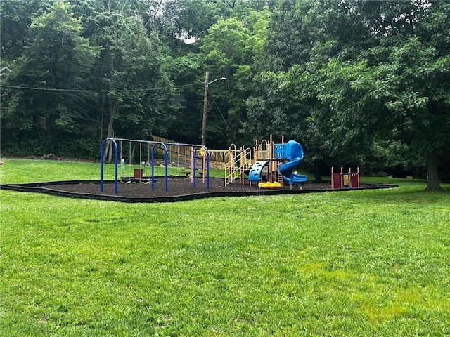 5539 NW Adrian Ave, Houston Lake, MO 64151 - communal playground featuring a yard and a forest view