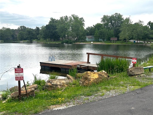 5539 NW Adrian Ave, Houston Lake, MO 64151 - dock area featuring a water view
